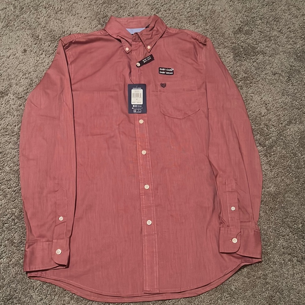 This is a red long sleeve easy care button down shirt.